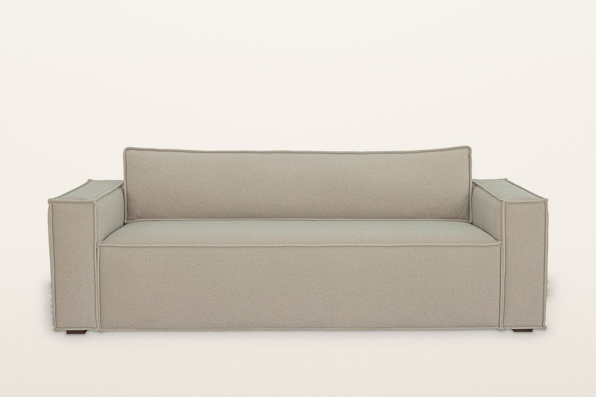 Agerola sofa in Sand from the front: two wide track arms, a single bench seat and one long back cushion