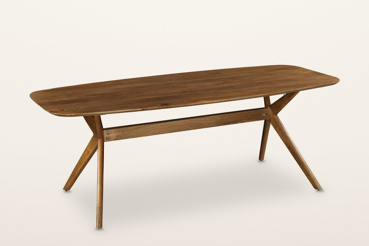 Amandola mango wood dining table in Light Walnut, three-quarter view on a warm white studio backdrop