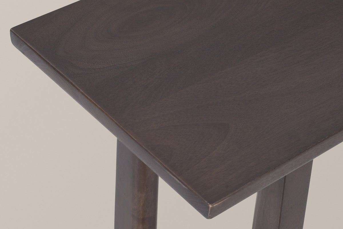 Close-up of the Amelia top corner in mocha: a deep espresso finish over the grain of solid mango wood and a softly eased edge