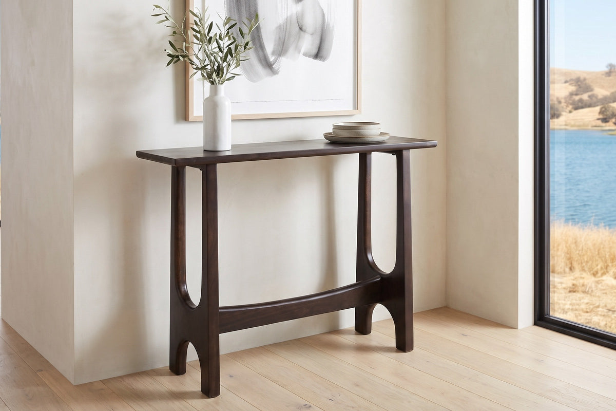 Amelia console table in mocha in a pale lake house hall near Kelowna, a white vase of olive branches at one end