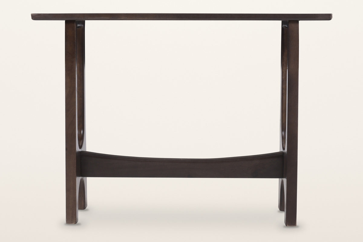 Amelia console table in mocha, straight front view: a thin top on two slotted trestles joined by a curved stretcher