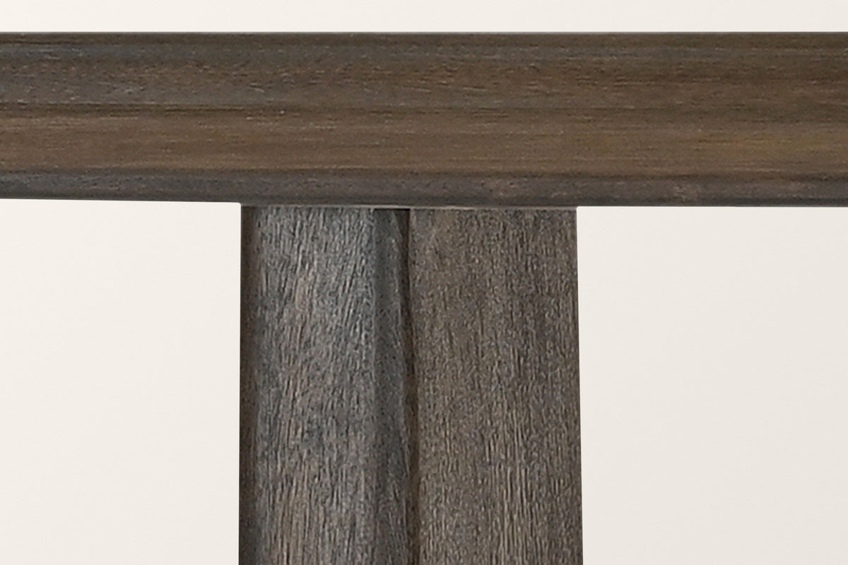 Close-up of an Anghiari slab leg meeting the underside of the top, solid mango wood in mocha