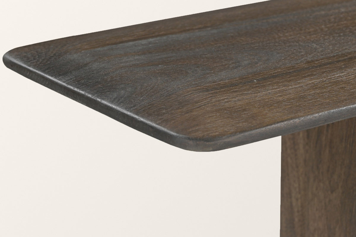 Close-up of the Anghiari top corner in mocha: a rounded corner and a softly rounded one-inch edge of solid mango wood