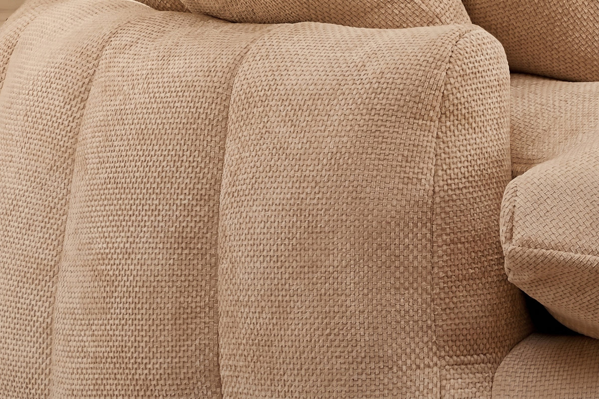 Close-up of a squared arm end and the plump vertical channels in coffee chenille
