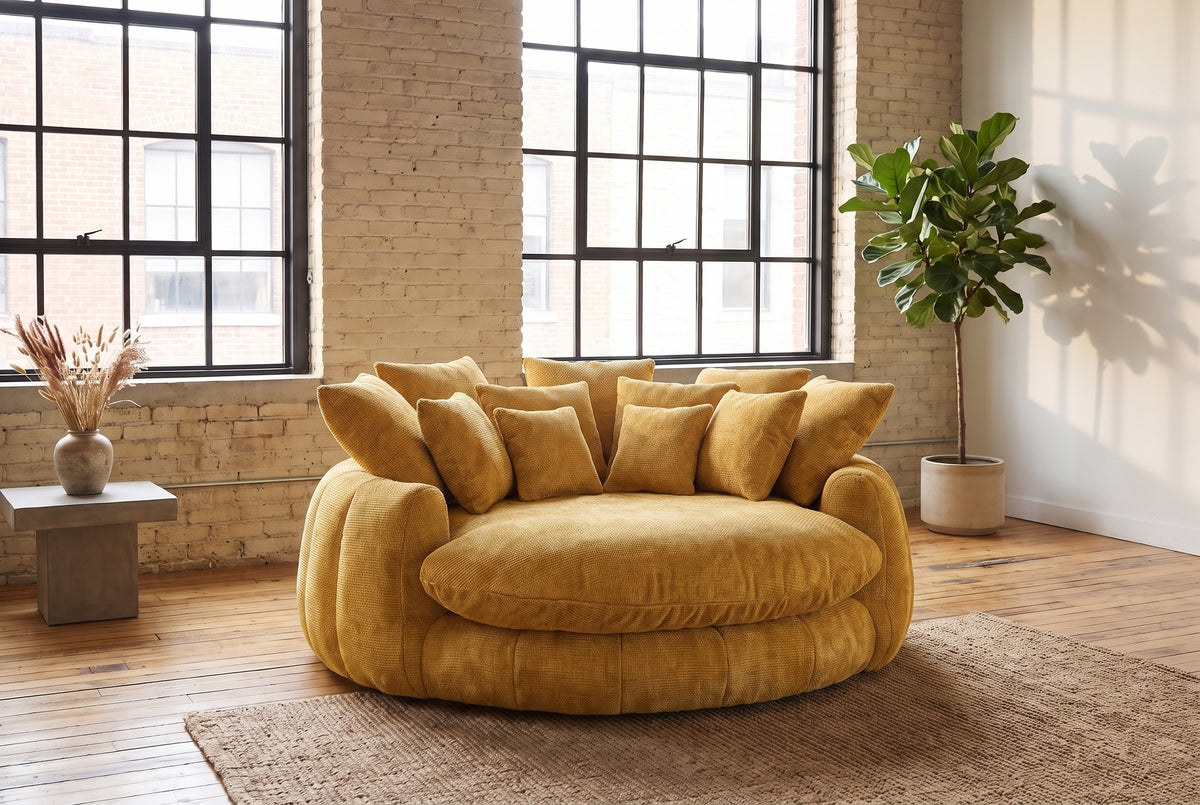 Aosta lounge chair on a jute rug in a Montreal loft with pale brick walls and steel factory windows (Yellow)