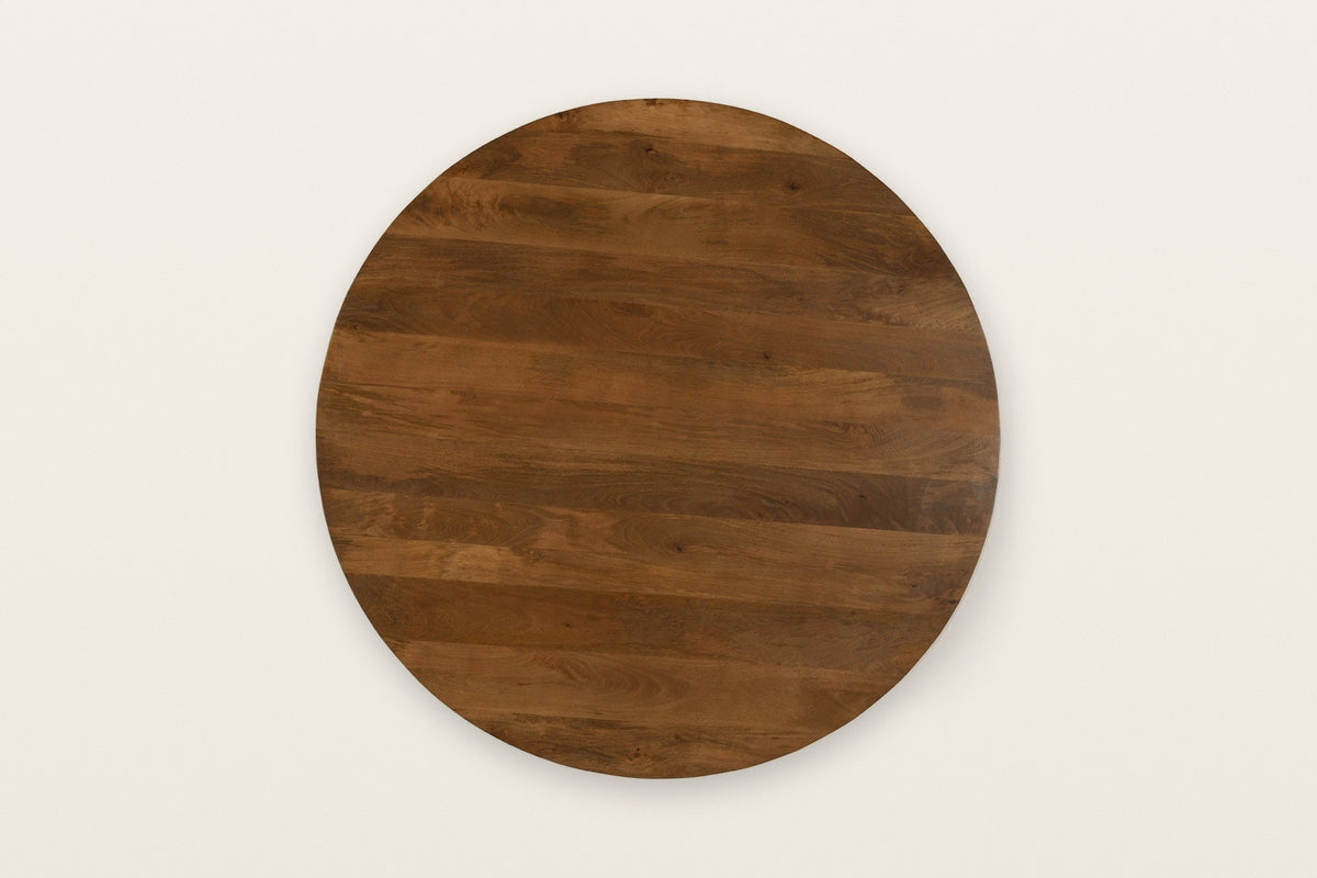 The round Apecchio top seen from above in walnut and teak, the mango planks running one way across it