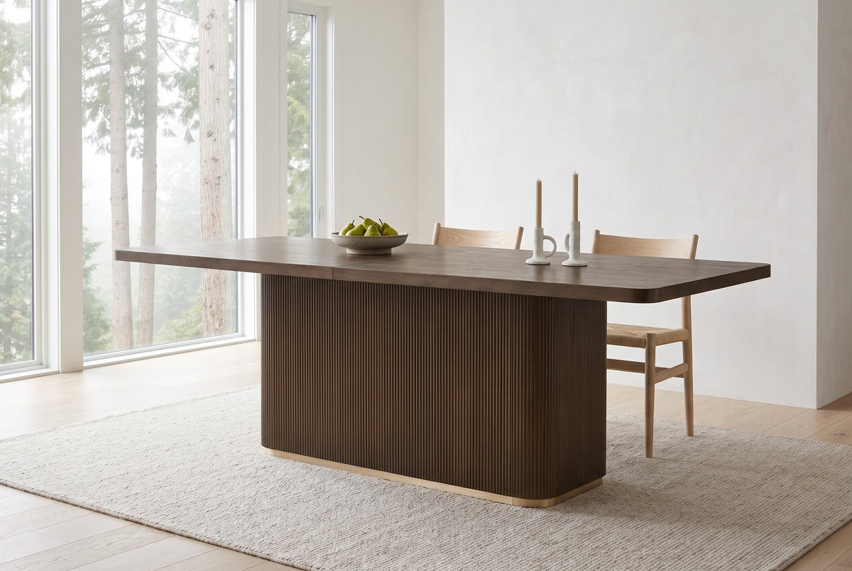 Aquileia dining table in a bright Vancouver dining room on a foggy morning, a bowl of pears and two candles on top