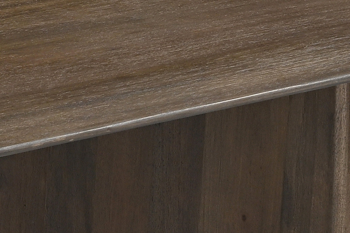 Close-up of the Arquata top's rounded edge over one slab leg, mocha finish