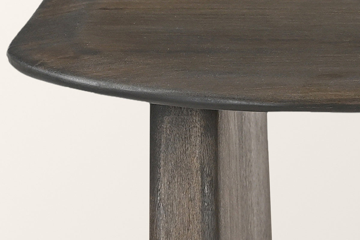Close-up of the Arquata top's rounded edge over the end of a slab leg, mocha finish