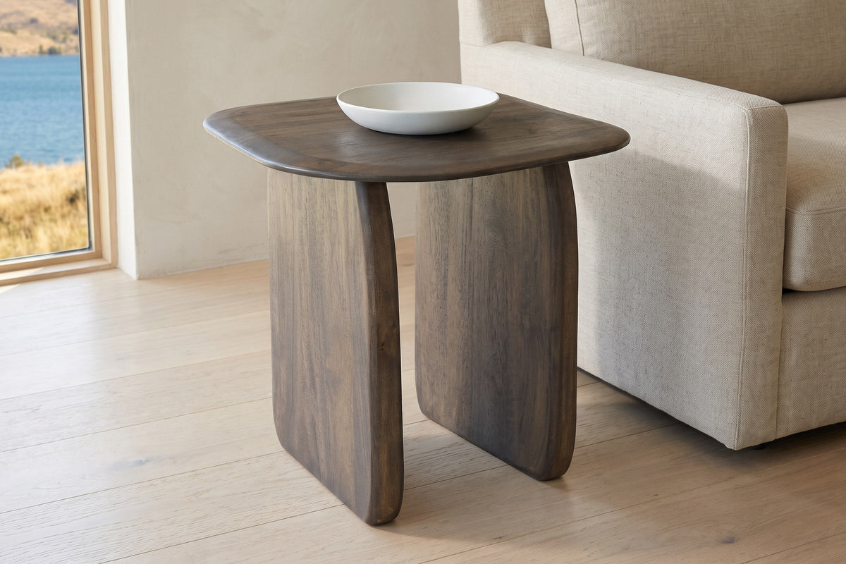 Arquata side table in mocha beside a linen sofa in a Kelowna lake house, a white ceramic bowl on top