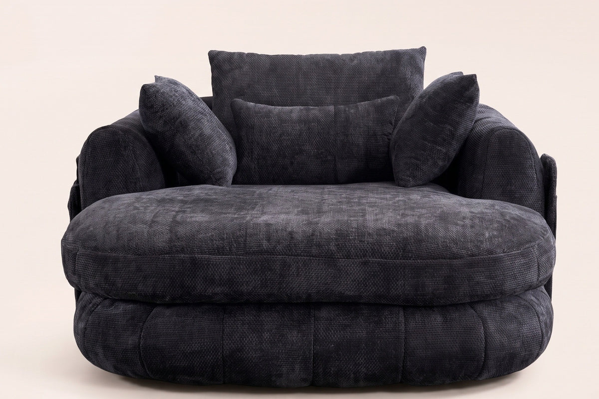 Asolo chaise lounge in Black chenille, front view: the oval seat cushion, the channelled base and four pillows