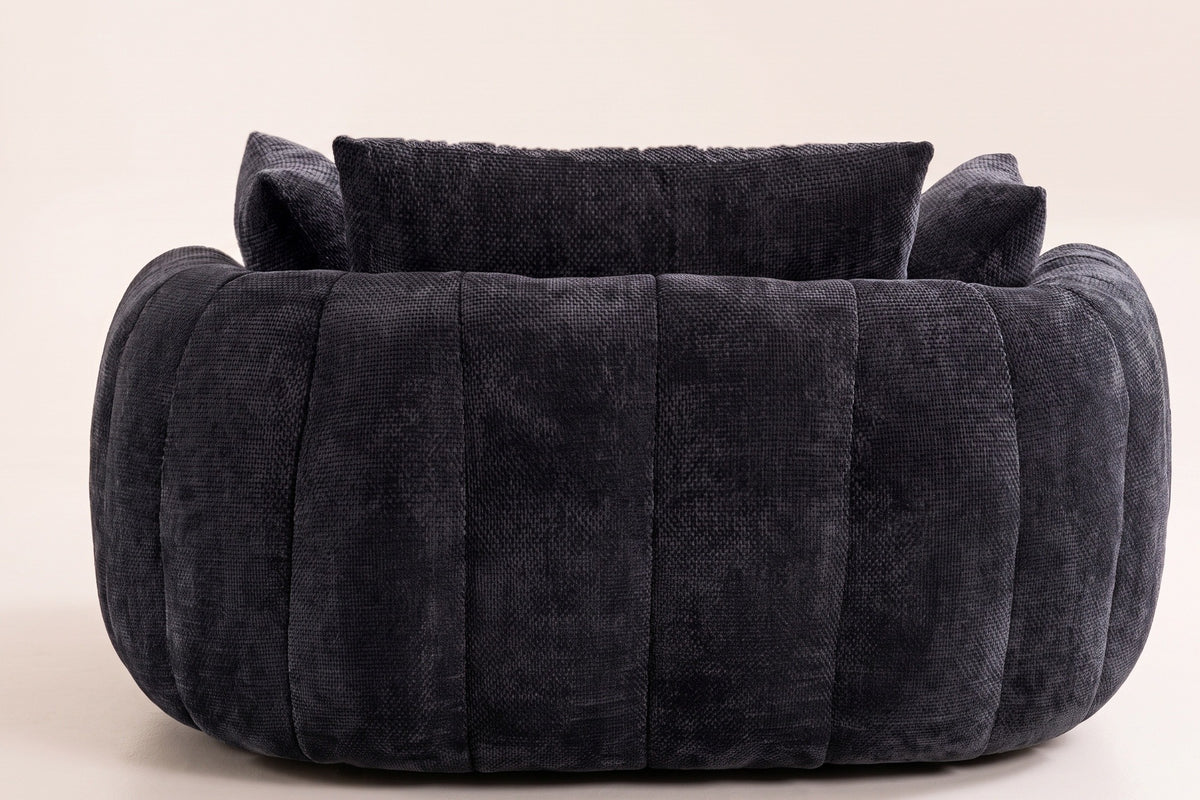 The back of the Asolo chaise lounge, channel-tufted all the way round