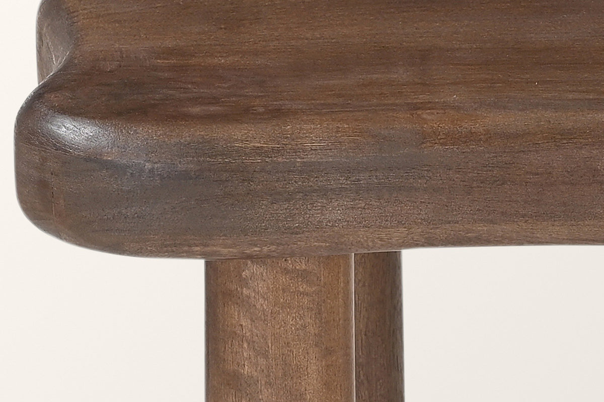 Close-up of the Atri: the thick rounded edge of the top and two round post legs meeting its underside