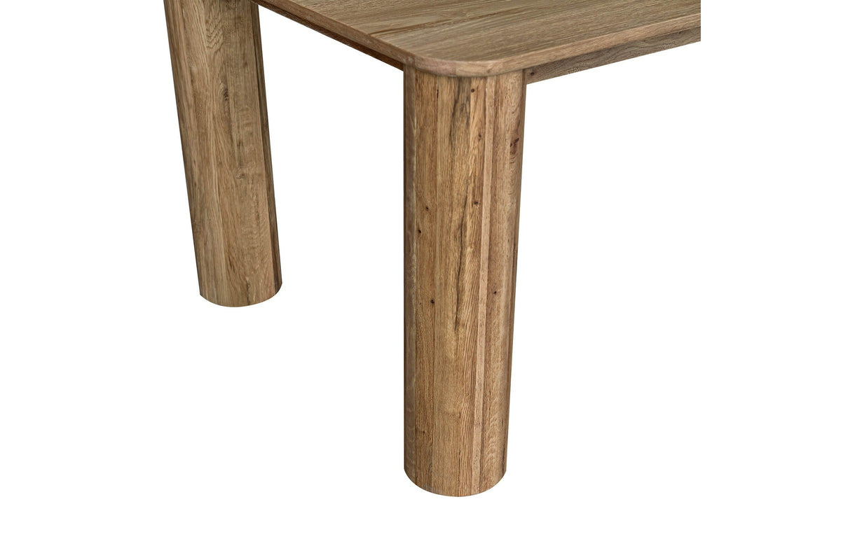 Close-up of two Atzara column legs under a rounded corner: straight round oak columns with flat feet
