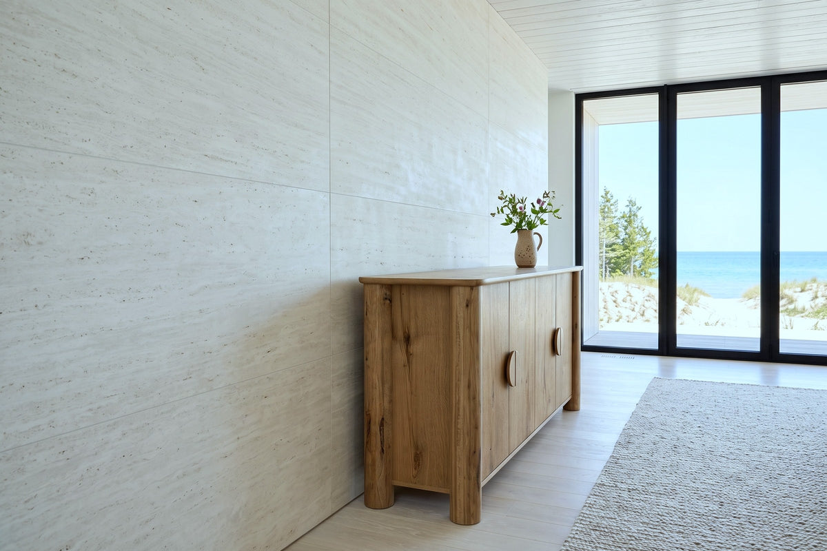 Atzara sideboard in Natural seen from the end against a travertine wall in a Southampton beach house on Lake Huron