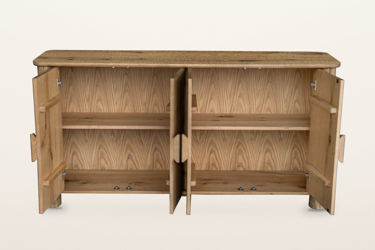 Atzara sideboard in Natural with all four doors open on a warm white studio backdrop, showing a shelf on each side