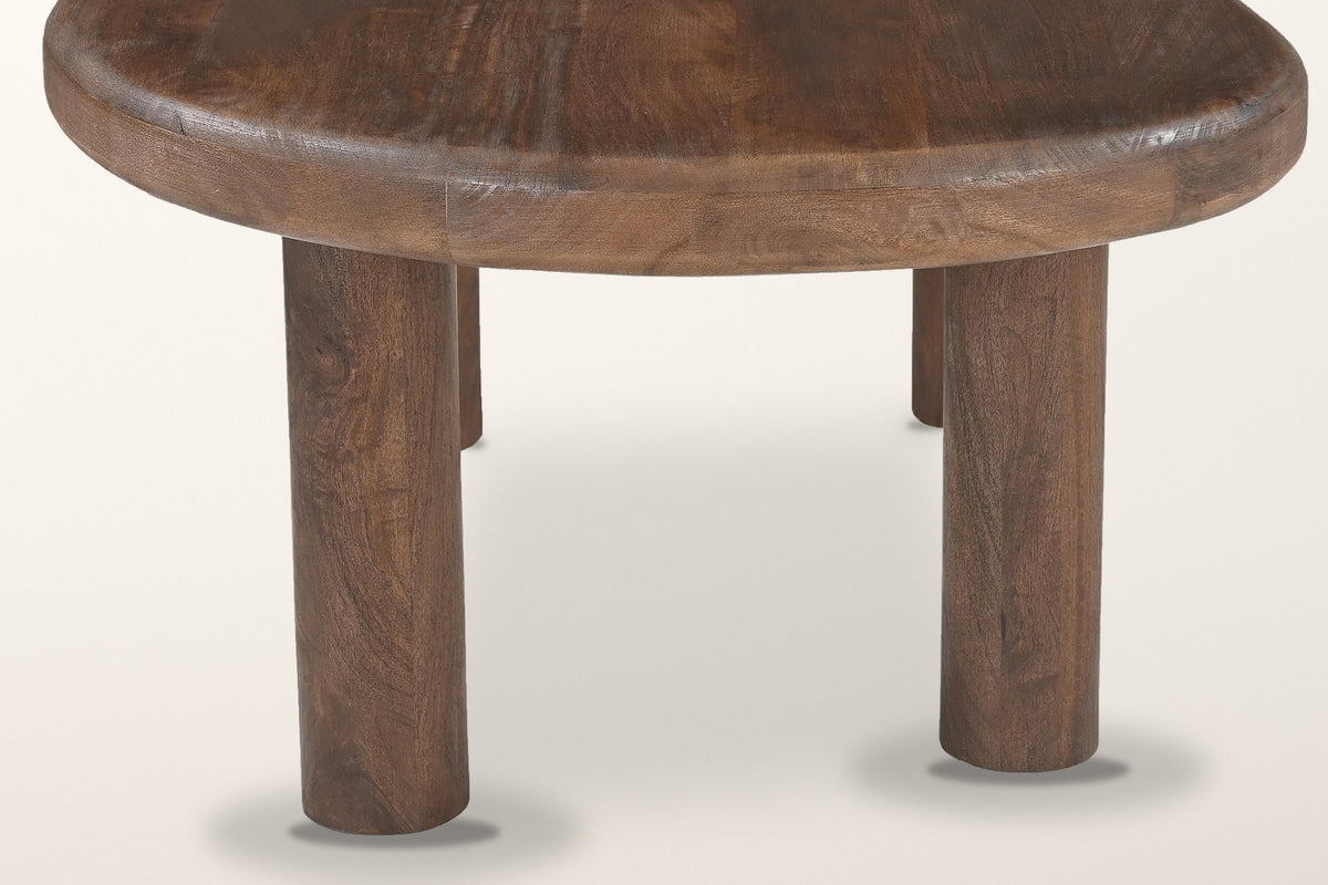 Close-up of the Bagnoregio base: round solid mango post legs meeting the underside of the rounded slab
