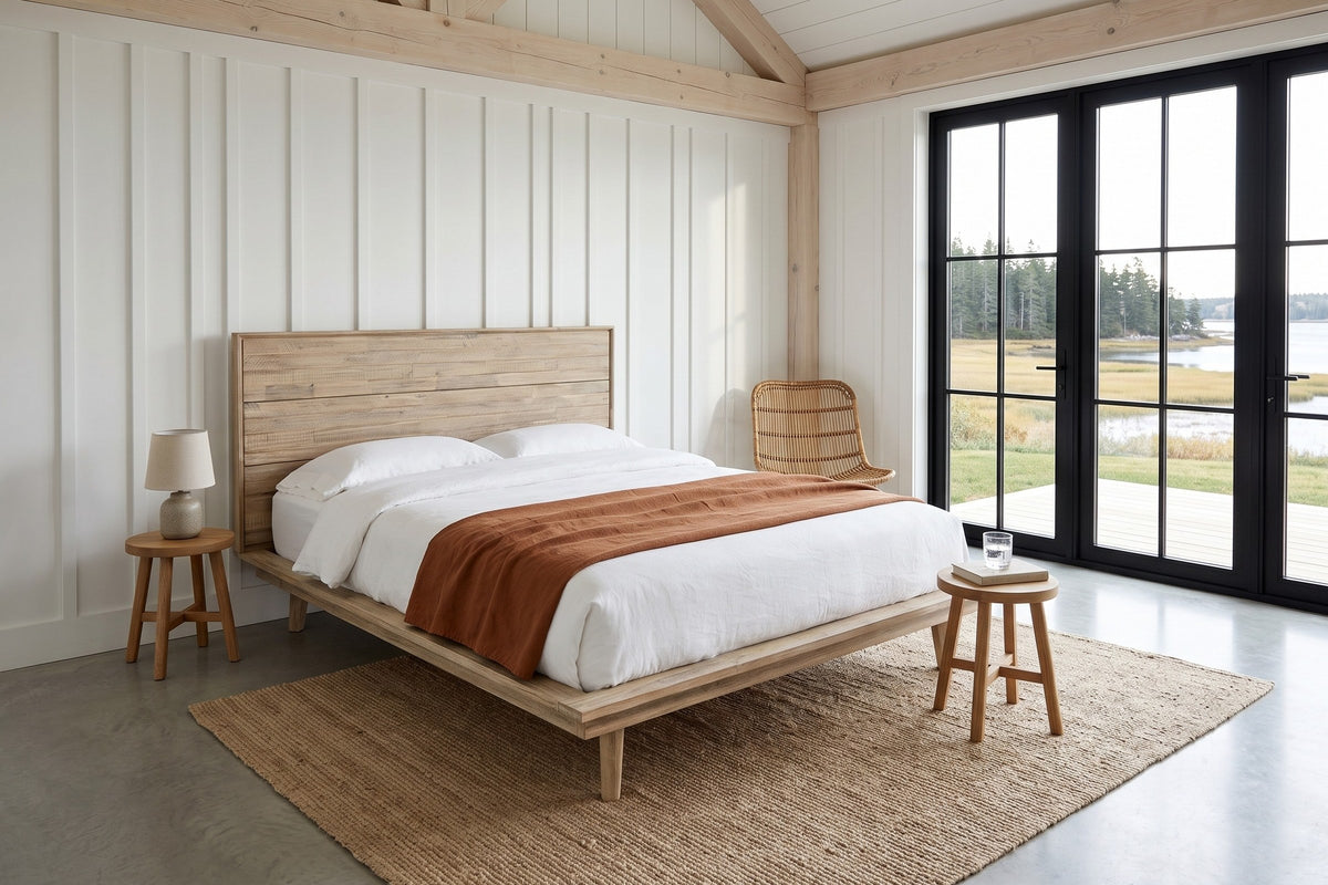Bassiano bed in Light Driftwood in a bedroom in an Antigonish coastal barn, three-quarter view from the other foot corner