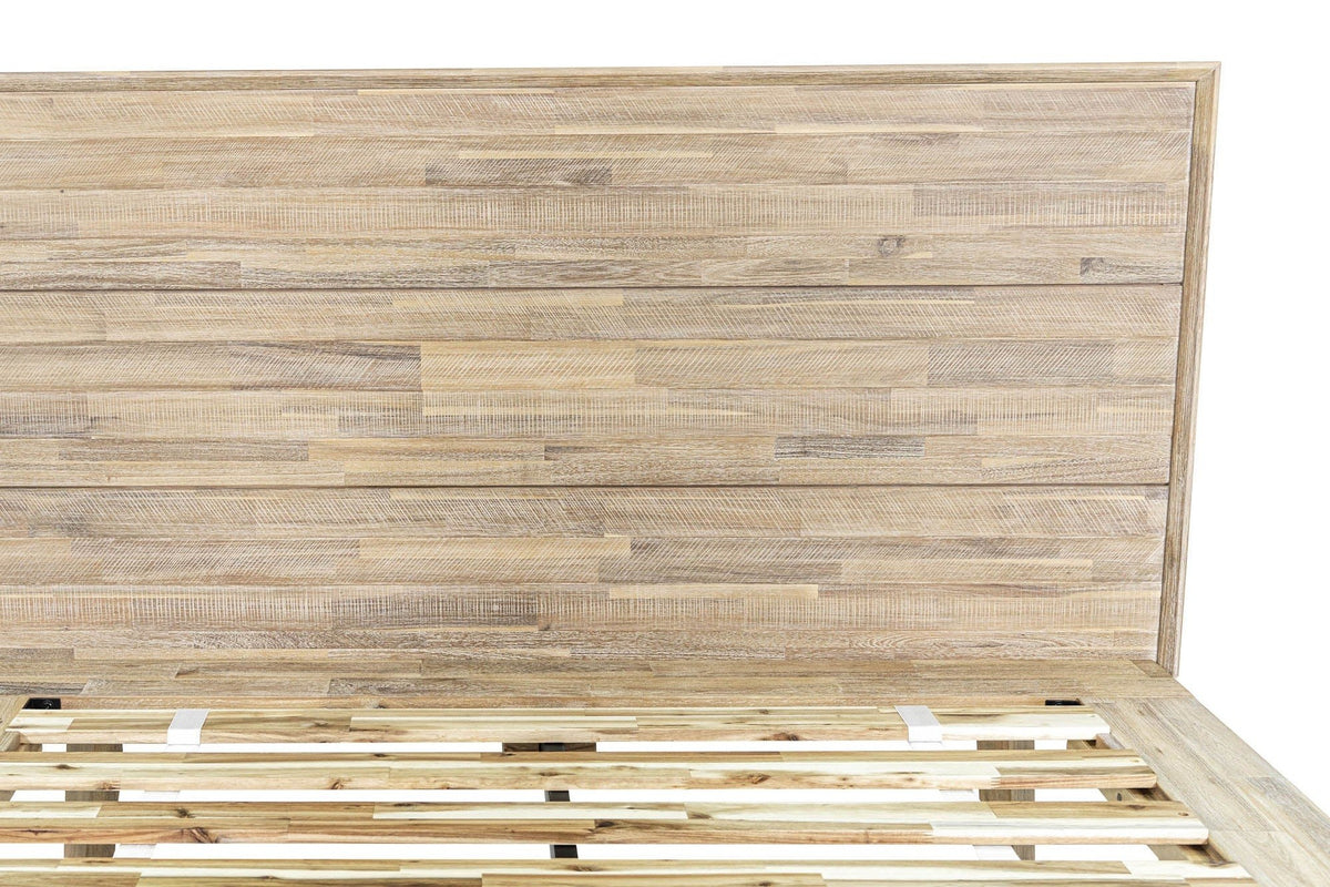 Close-up of the Bassiano headboard in Light Driftwood: three bands of short staggered acacia strips with a steel-brushed text