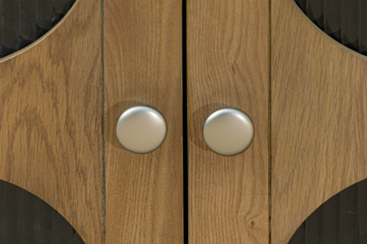 Close-up of Bellamy oak veneer doors and silver-tone round knobs