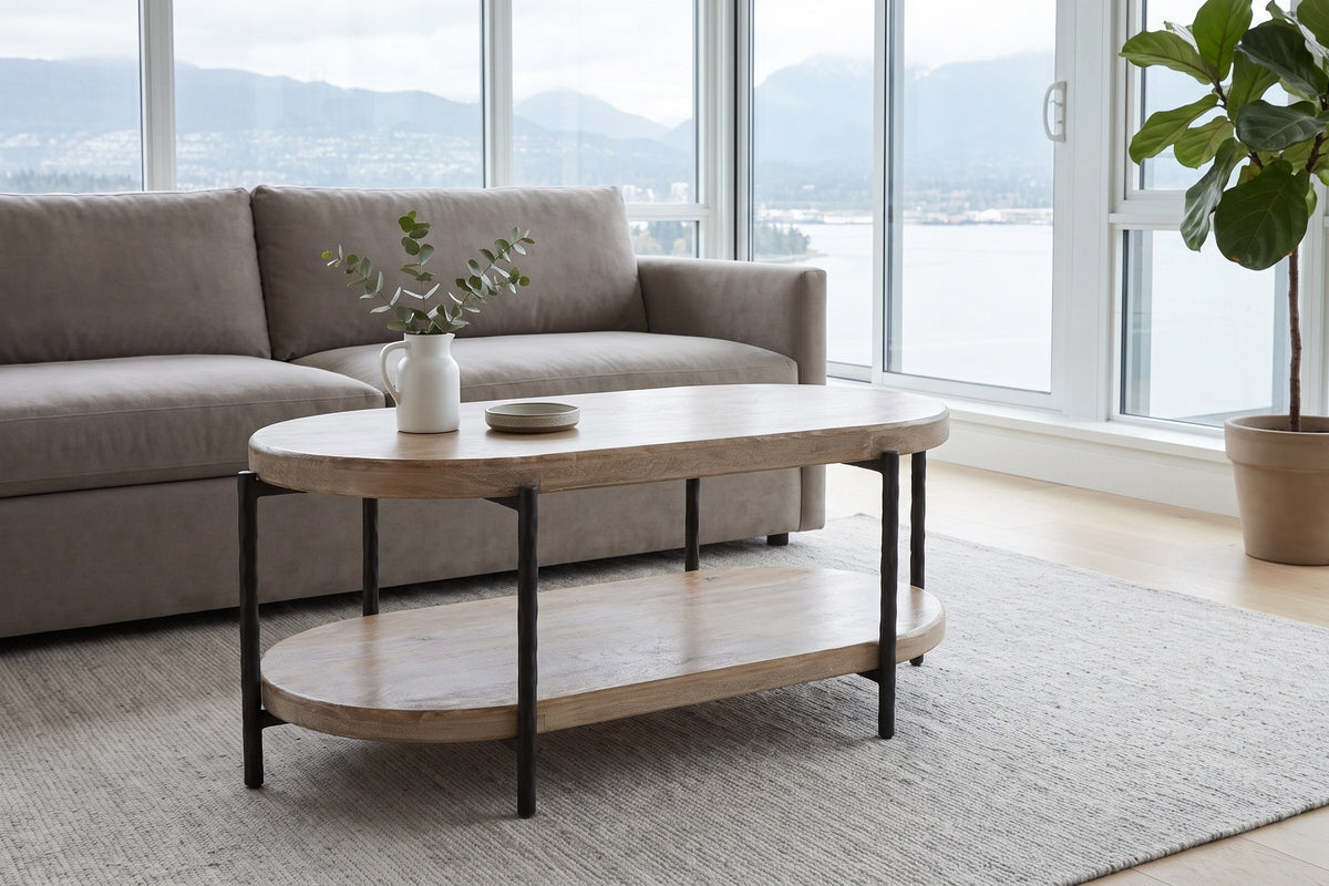 Bellano coffee table in a Vancouver condo by floor-to-ceiling windows, a white jug of eucalyptus on top