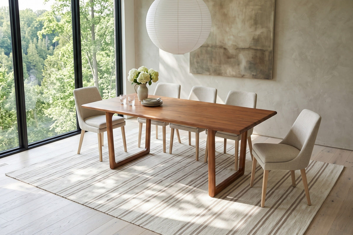 Bernalda dining table in Honey Brown seen from above in an Elora Gorge house, with greige plaster, a walnut ceiling