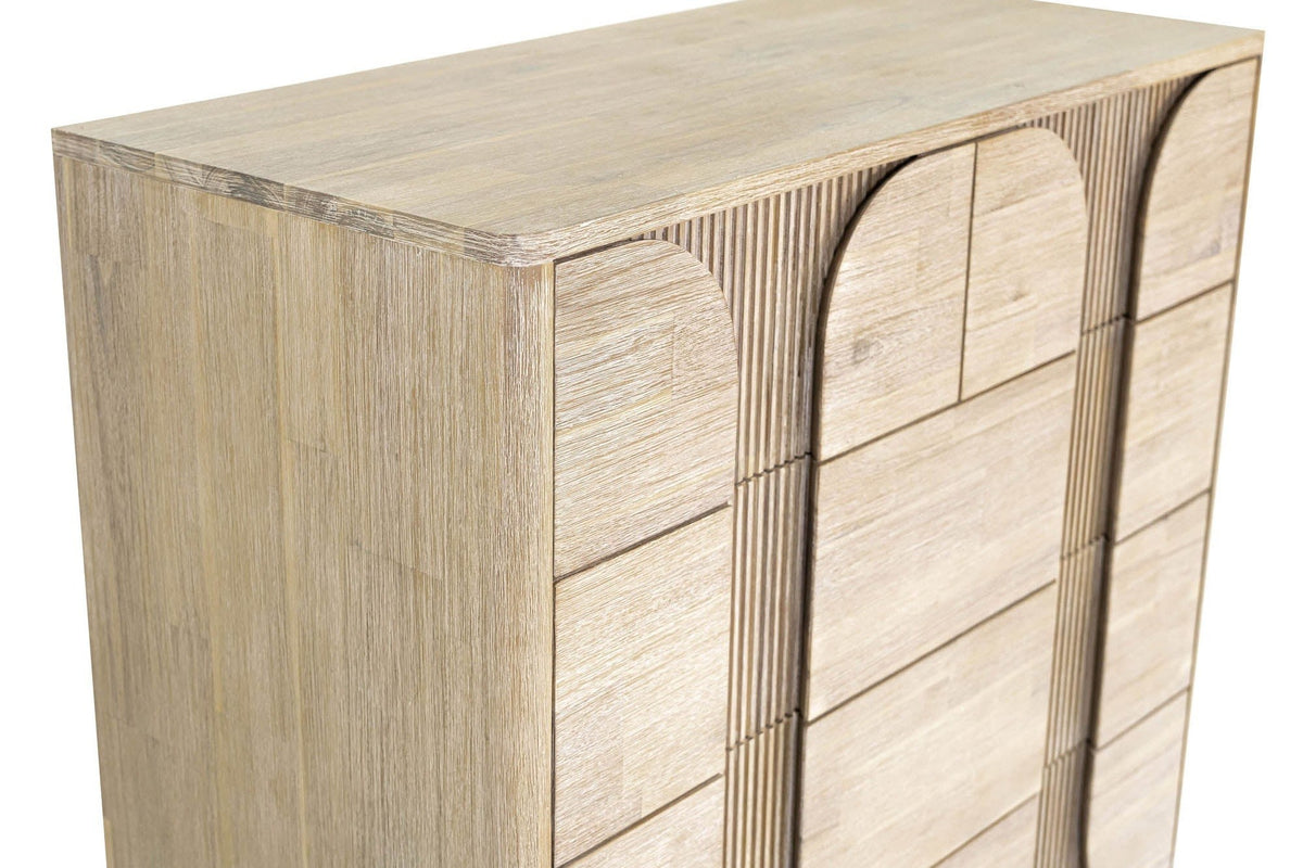 Close-up of the top corner of the Bienno chest in Sand Wash: the rounded front corner of the top, the side panel