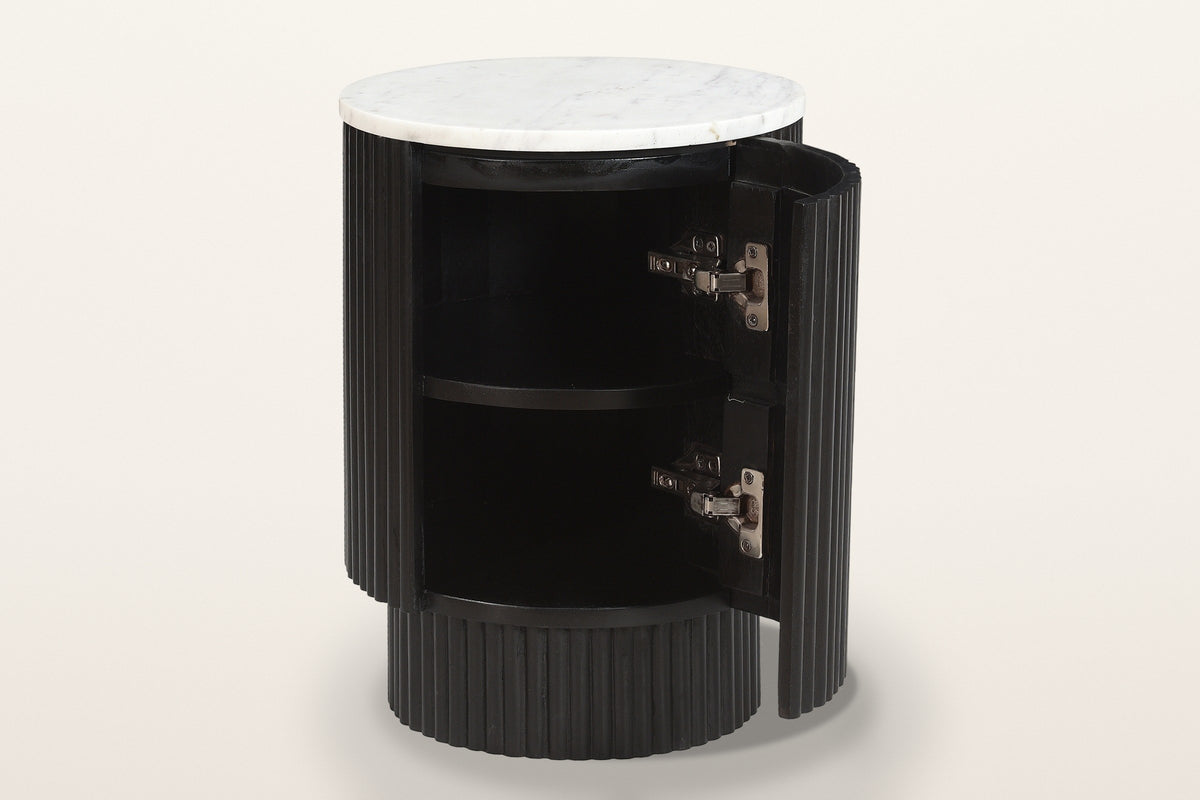 Bomarzo side table in black with its curved door open: one shelf inside the reeded drum