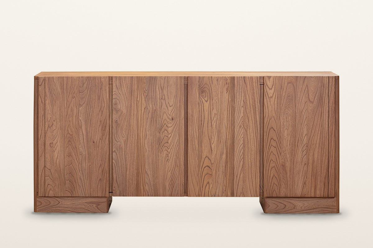 Bominaco sideboard in Brown, straight front view on a warm white studio backdrop: four slab doors of nearly equal width