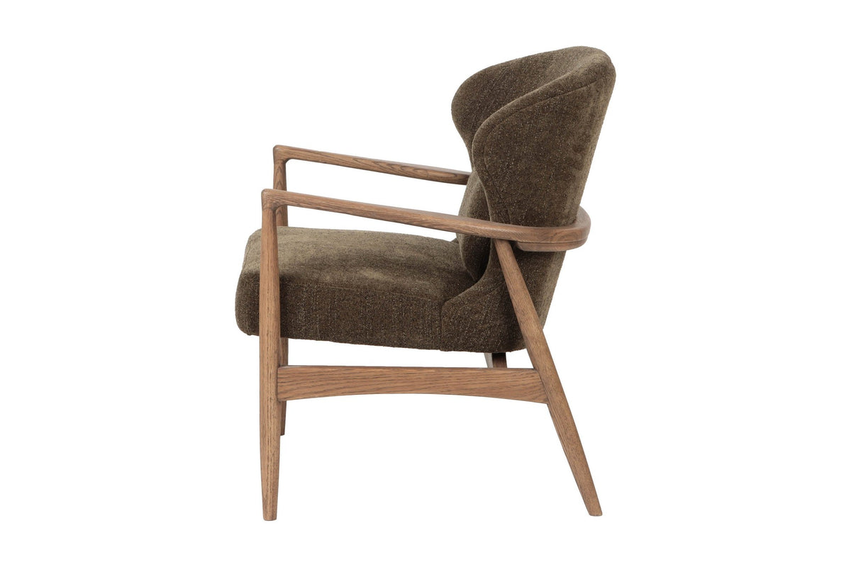 Briar accent chair in Nettle, side view of the curved back and ash frame