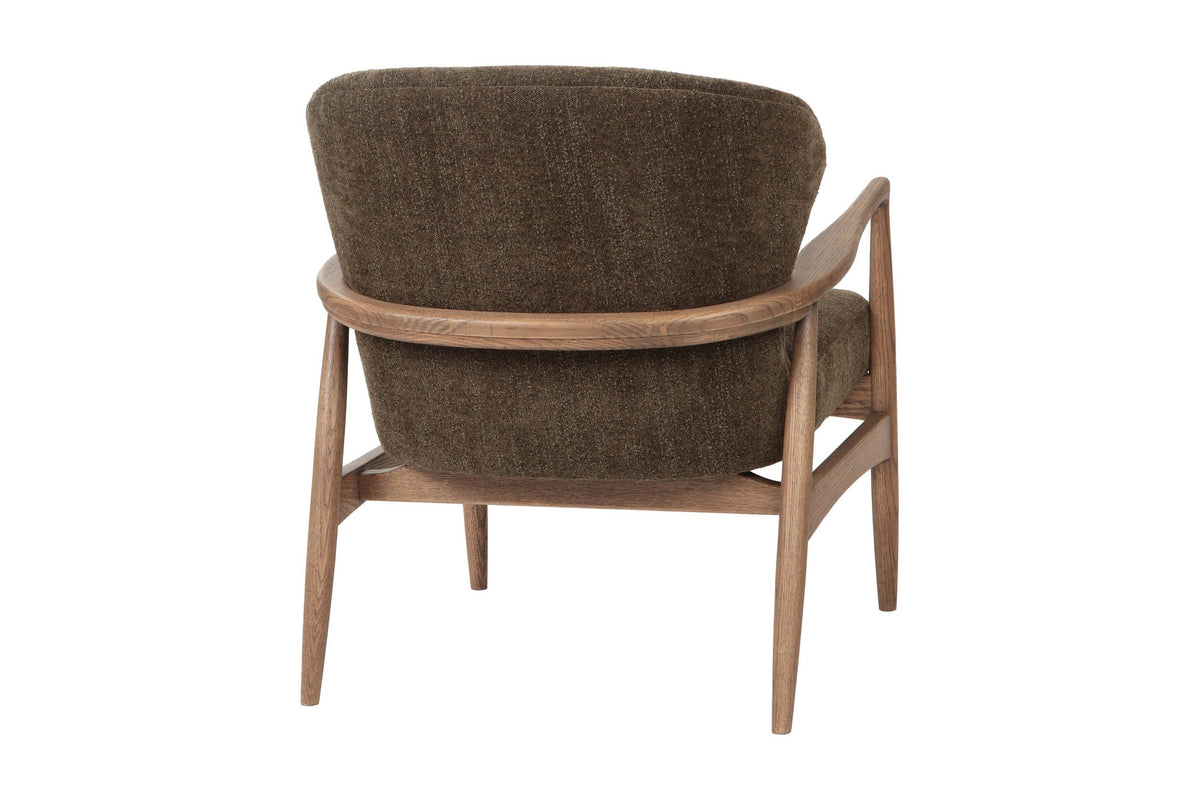 Briar accent chair in Nettle, back view with the ash rail wrapping the back