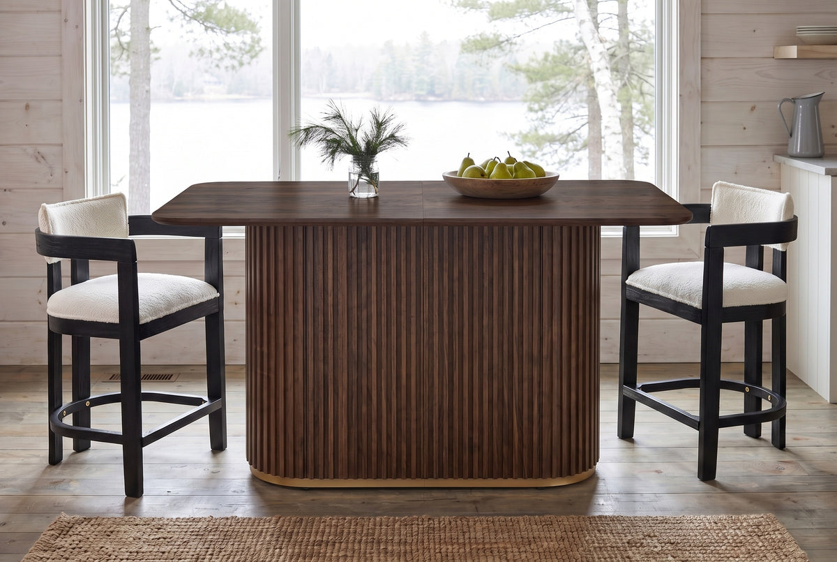 Brugnato counter table in walnut in a Muskoka cottage kitchen in front of a lake window, two counter stools at the ends