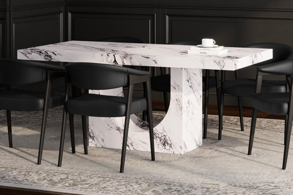 Bryce white marble-look dining table with arched base in a dark panelled dining room