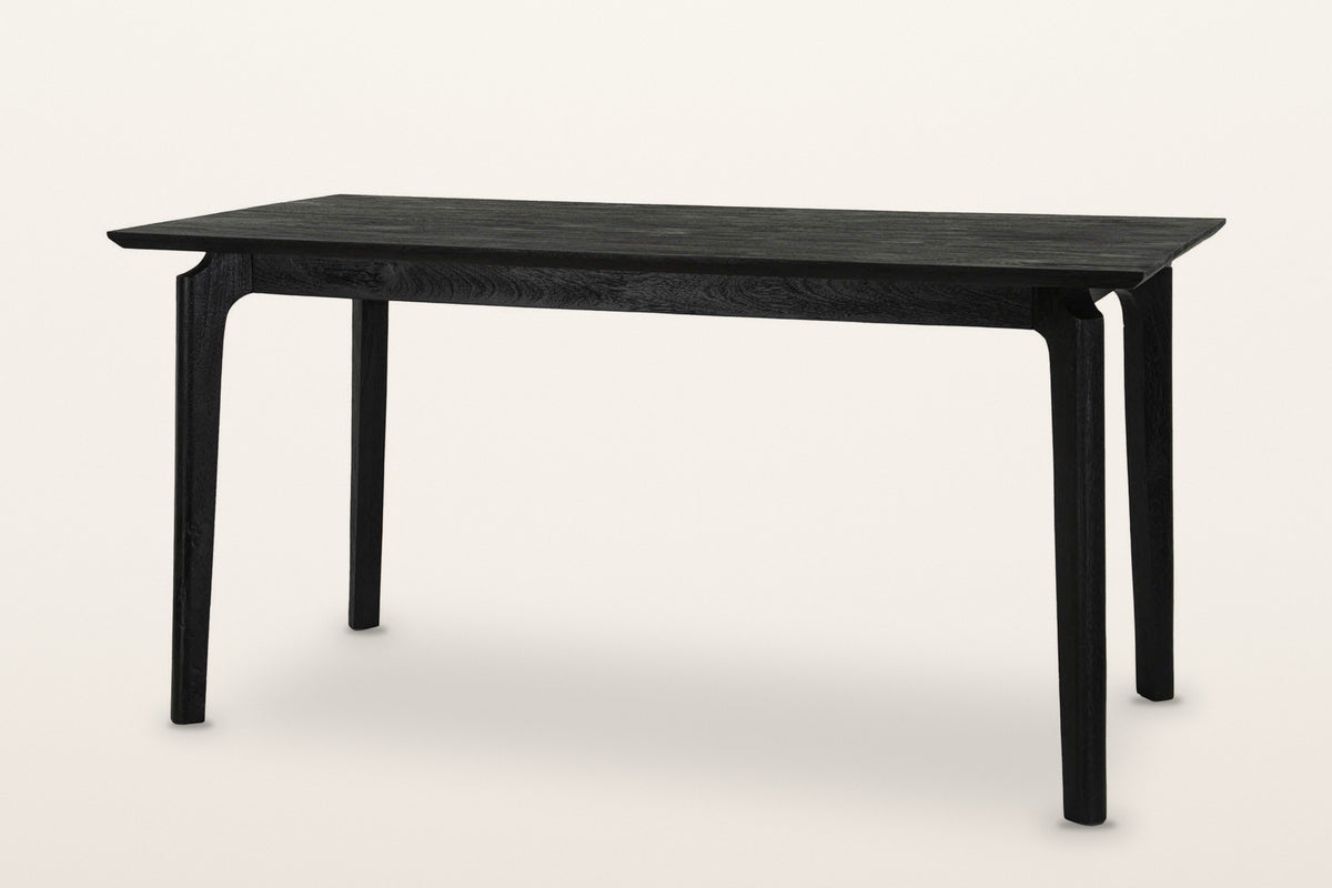 Calascio splayed leg dining table in Black, three-quarter view on a warm white studio backdrop
