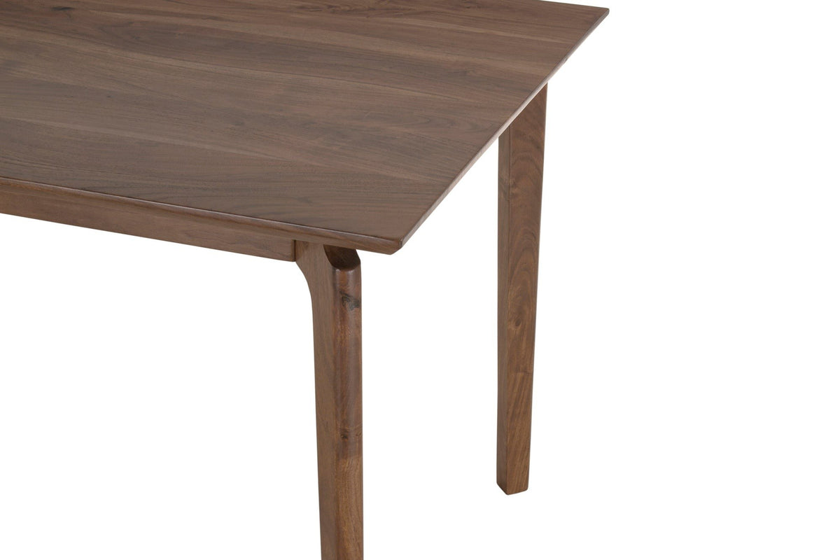 Close-up of a Calascio corner in Brown: the thin edge of the top and a leg curving into the rail