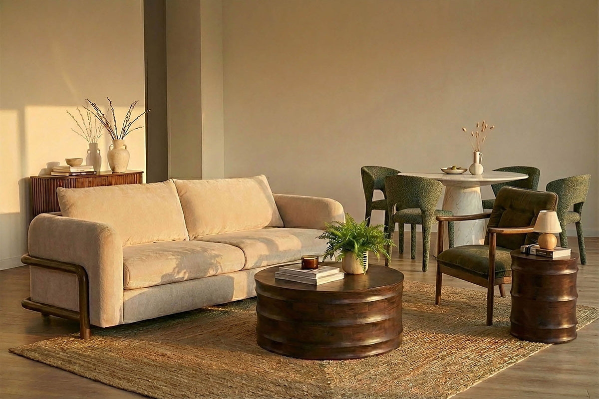 Calista Sand fabric sofa in a warm open-plan room next to a dining area