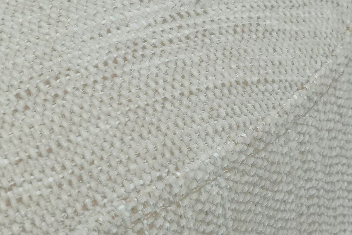 Close-up of the Caltagirone fabric in Oatmeal Sand: a textured slub weave and the welt at the top edge