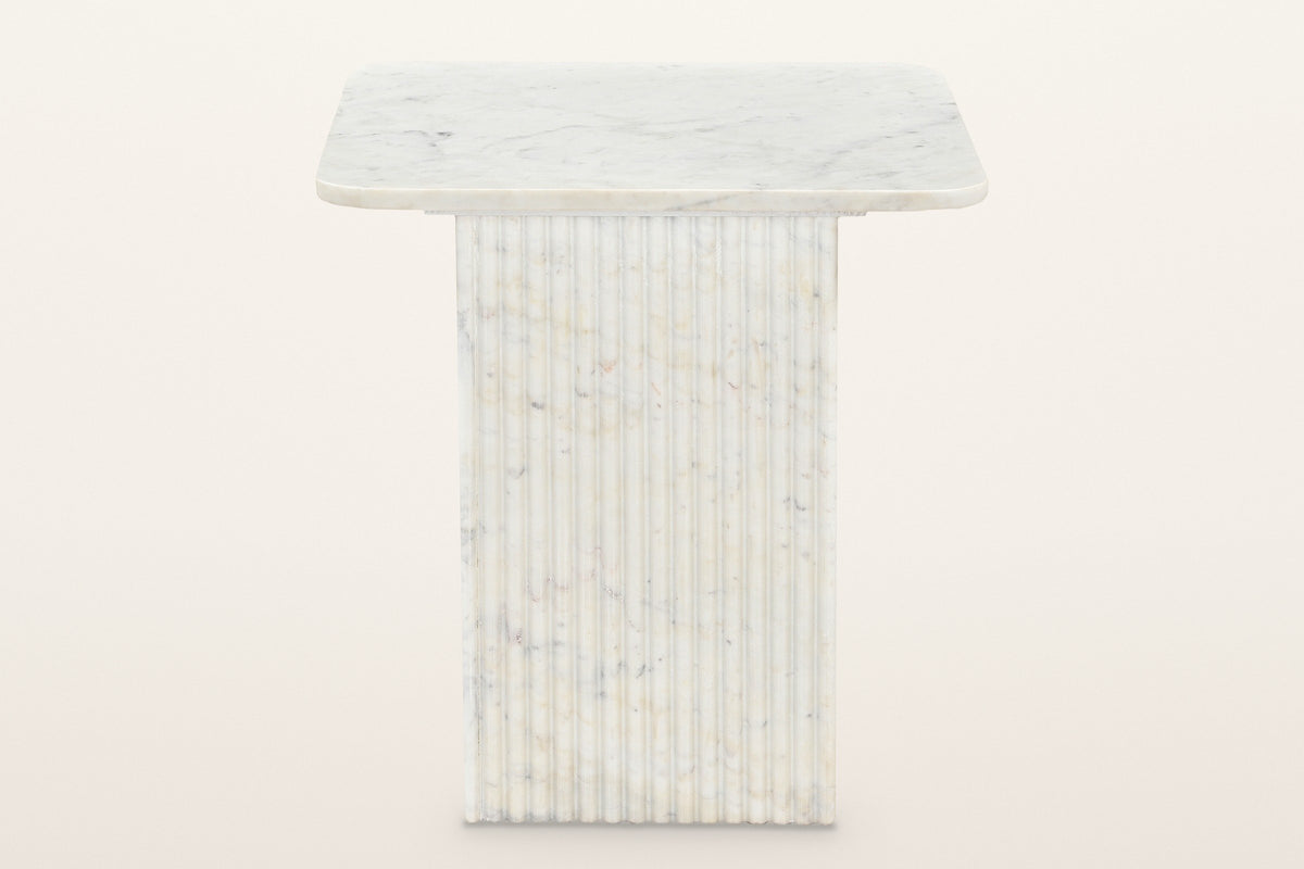 Camerota side table, straight front view: a thin square marble top on a fluted square marble pedestal