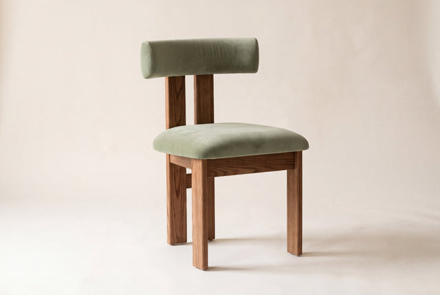 Carlo dining chair in olive green faux mohair velvet with a wire-brushed oak frame on a studio backdrop