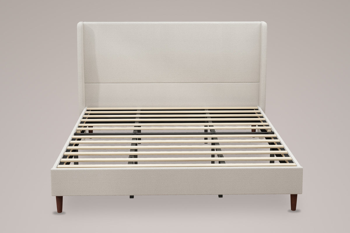 Carrara wingback bed in beige chenille, straight front view: tall headboard with one channel
