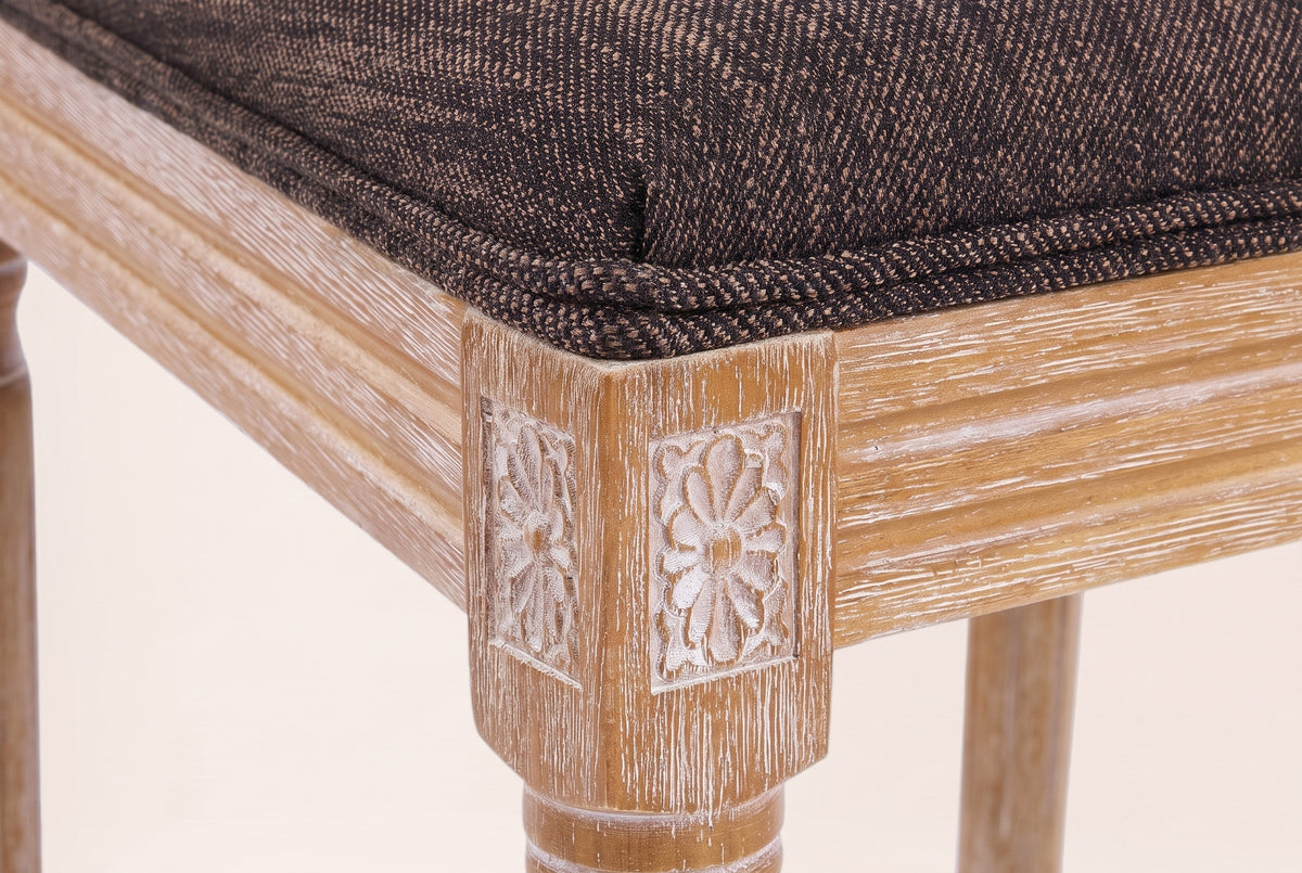 Close-up of a carved rosette corner block, the reeded seat rail, a turned front leg and the Brown seat edge
