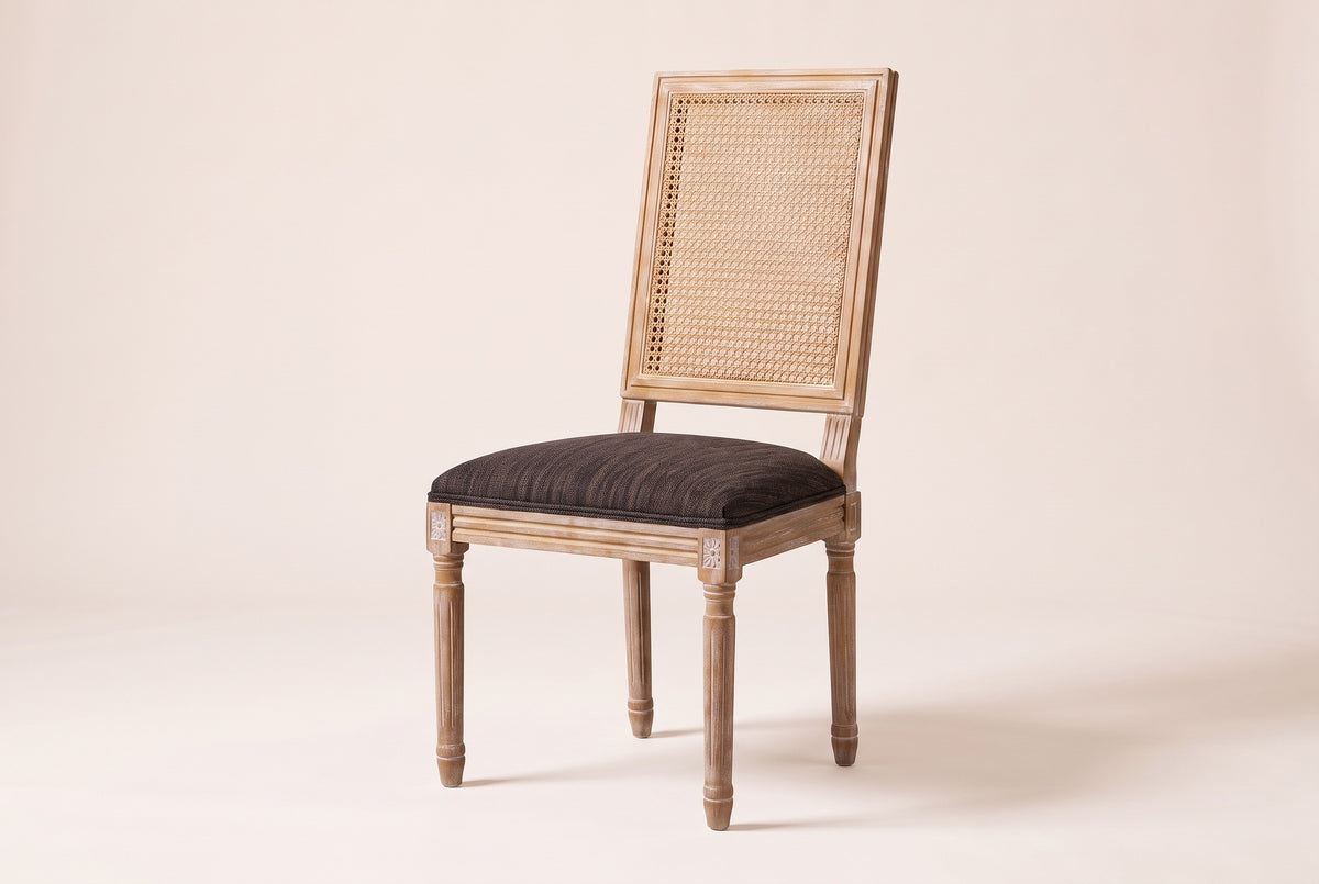 Castelfranco French cane-back dining chair in Brown, three-quarter view on a warm off-white backdrop