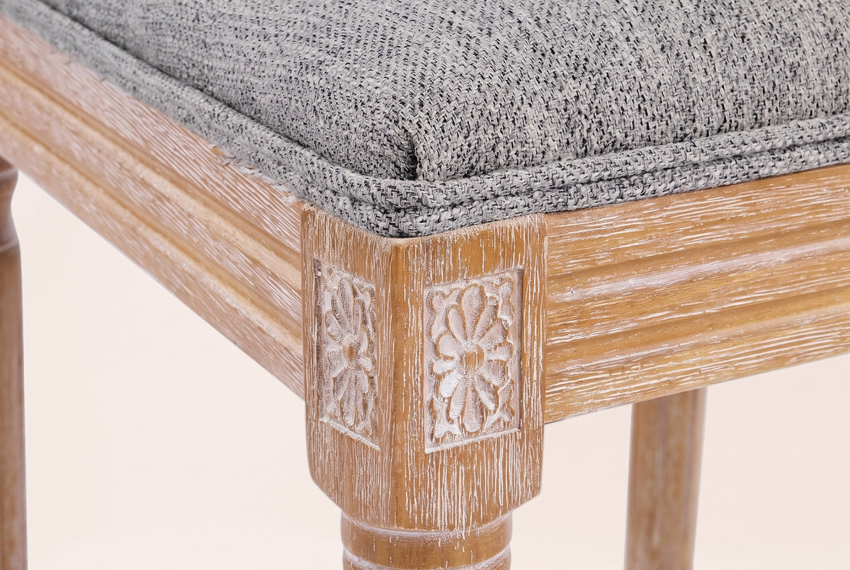 Close-up of a carved rosette corner block, the reeded seat rail, a turned front leg and the Mid Grey seat edge