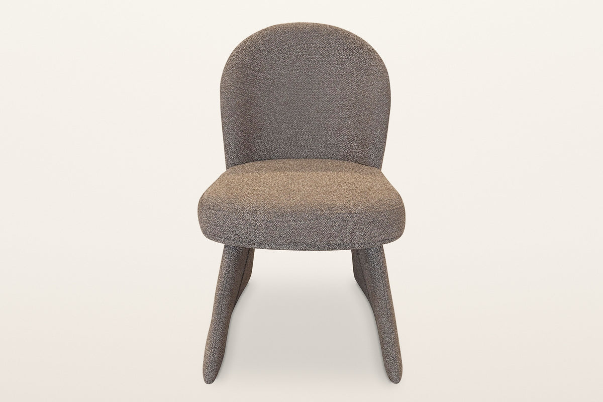 Castellabate dining chair in brown, straight front view: the rounded back, the thick seat and the two flared side panels