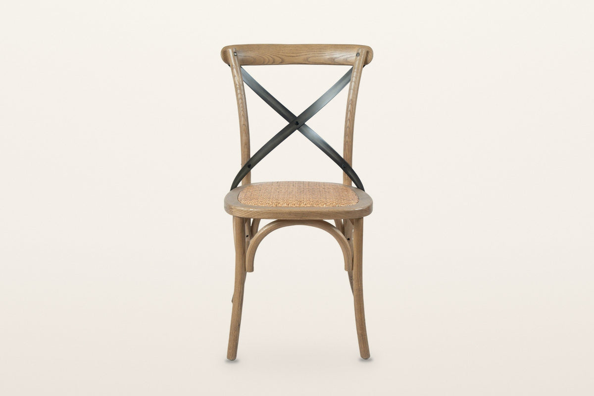 Castelmola dining chair in Natural Rustic, front view on a warm white studio backdrop