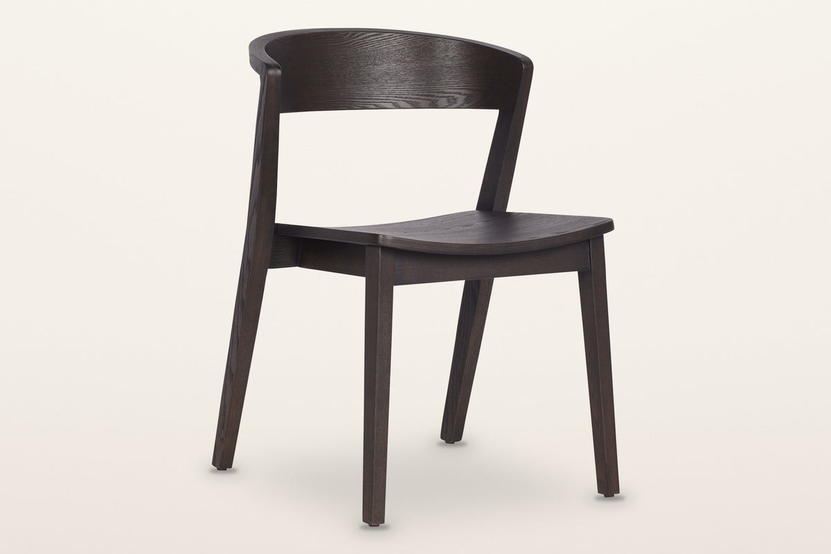 Certosa dining chair in mocha, three-quarter view on a warm white studio backdrop