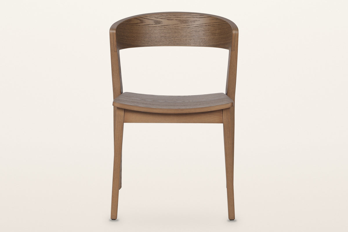 Certosa dining chair in walnut, straight front: the curved back band, the dished seat and four tapered legs