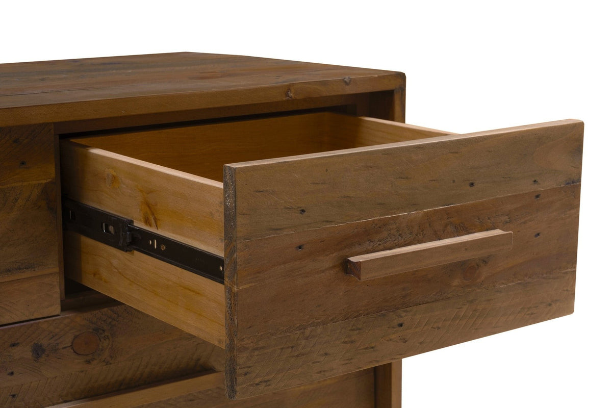A Cervinia top drawer pulled open on its metal ball-bearing runner, a pale wood drawer box and the plank front with its wooden bar pull