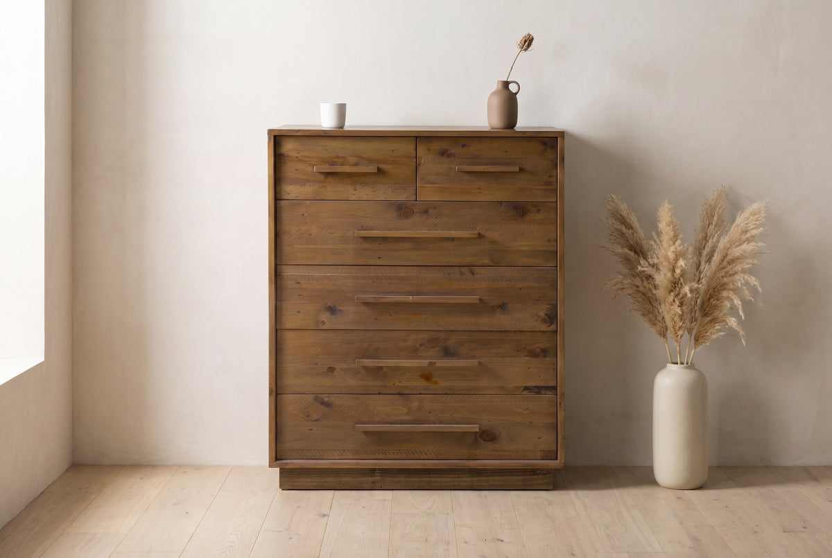 Cervinia reclaimed pine chest straight on against an off-white plaster wall in a Glebe, Ottawa bedroom, dried pampas grass beside it