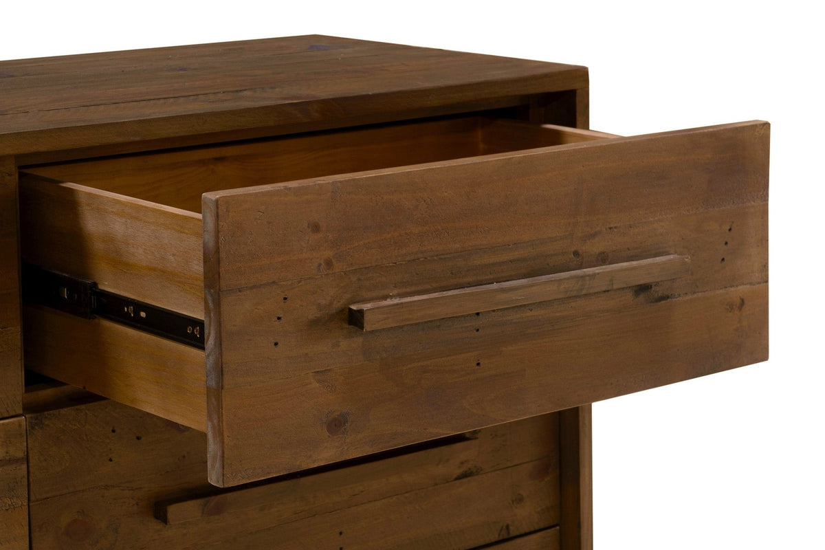 Close-up of an open Cervinia drawer: the plank front, the square wooden bar pull and the metal ball-bearing runner on the side